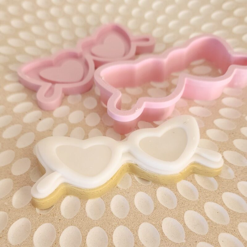 A product display image of our cookie debosser and cutter in the taylor swift inspired sunglasses, theme.